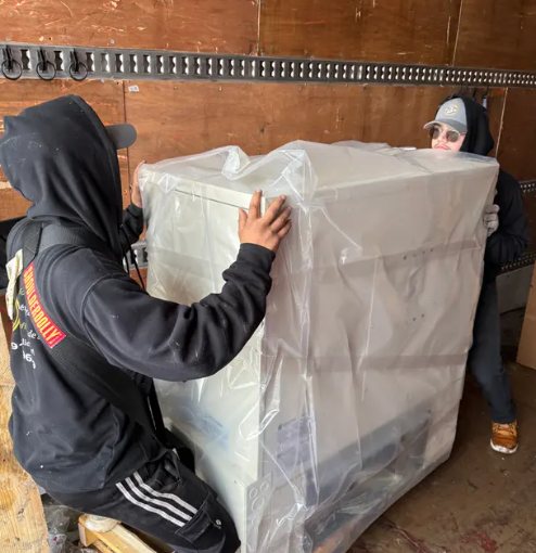 Wrapped appliance loaded into the truck