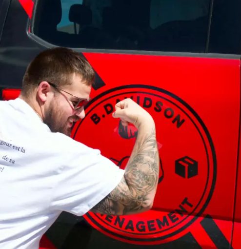 Davidson mover in front of the red truck