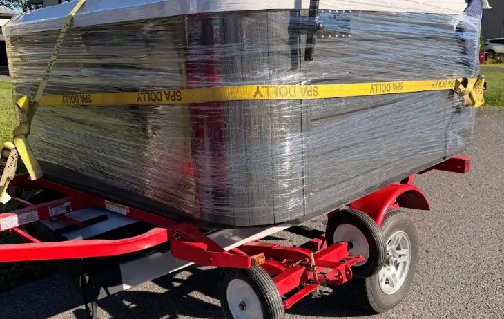 Hot tub wrapped and strapped on the Davidson trailer